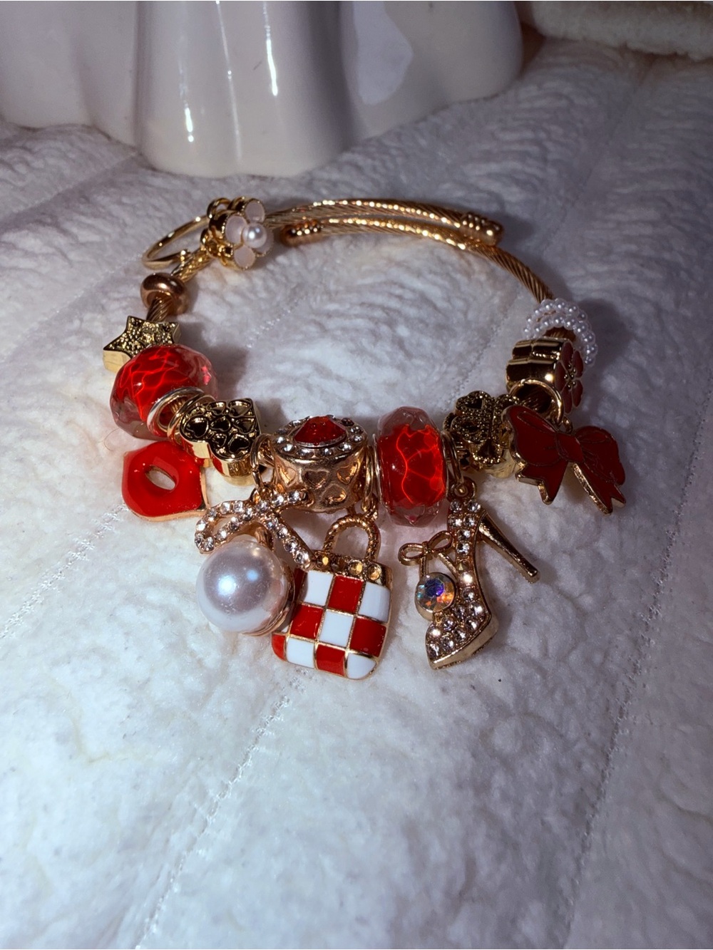 Gold Charm Bracelet with Red Accents and Charms